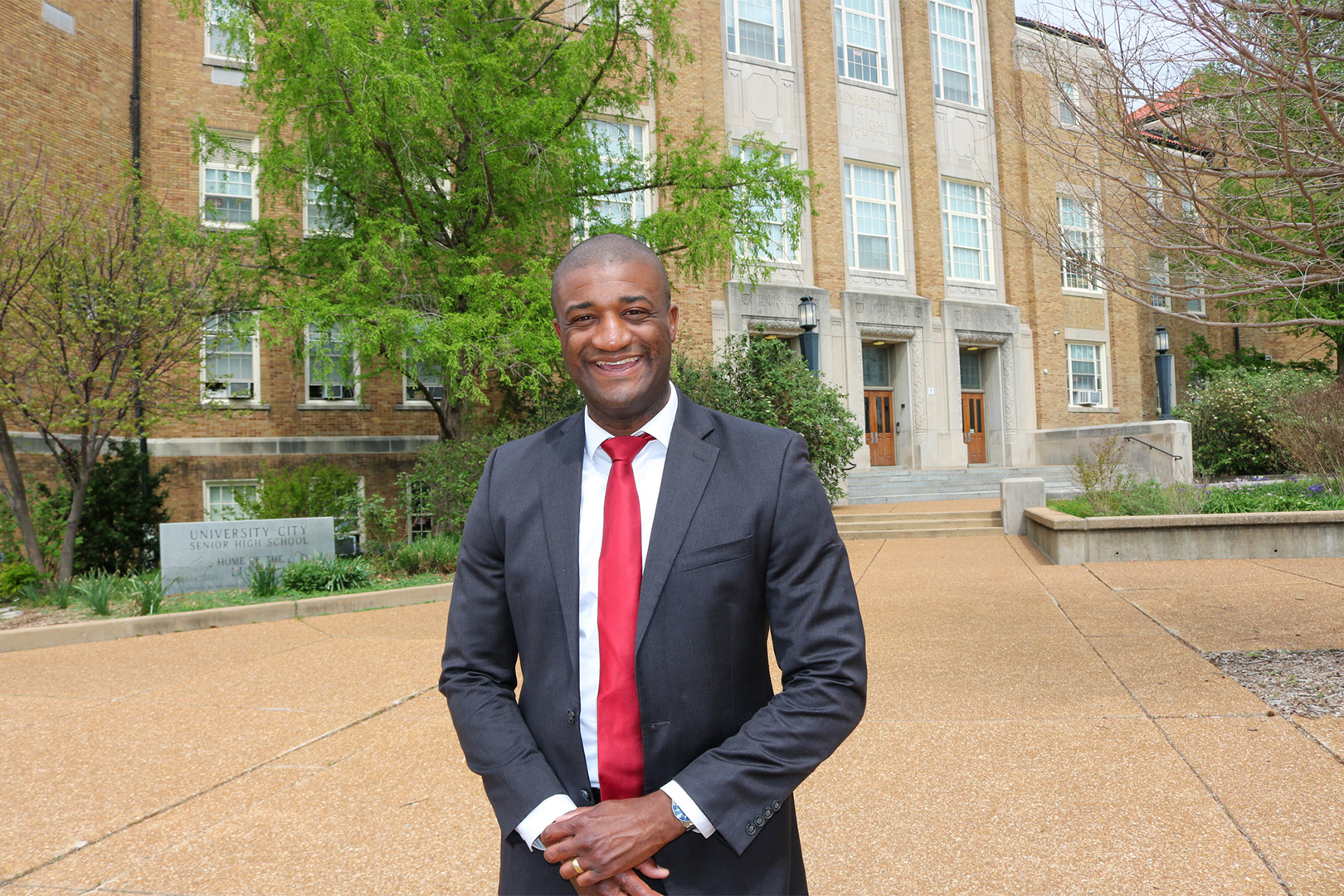 Vernon Norman standing in front of University City Senior High School