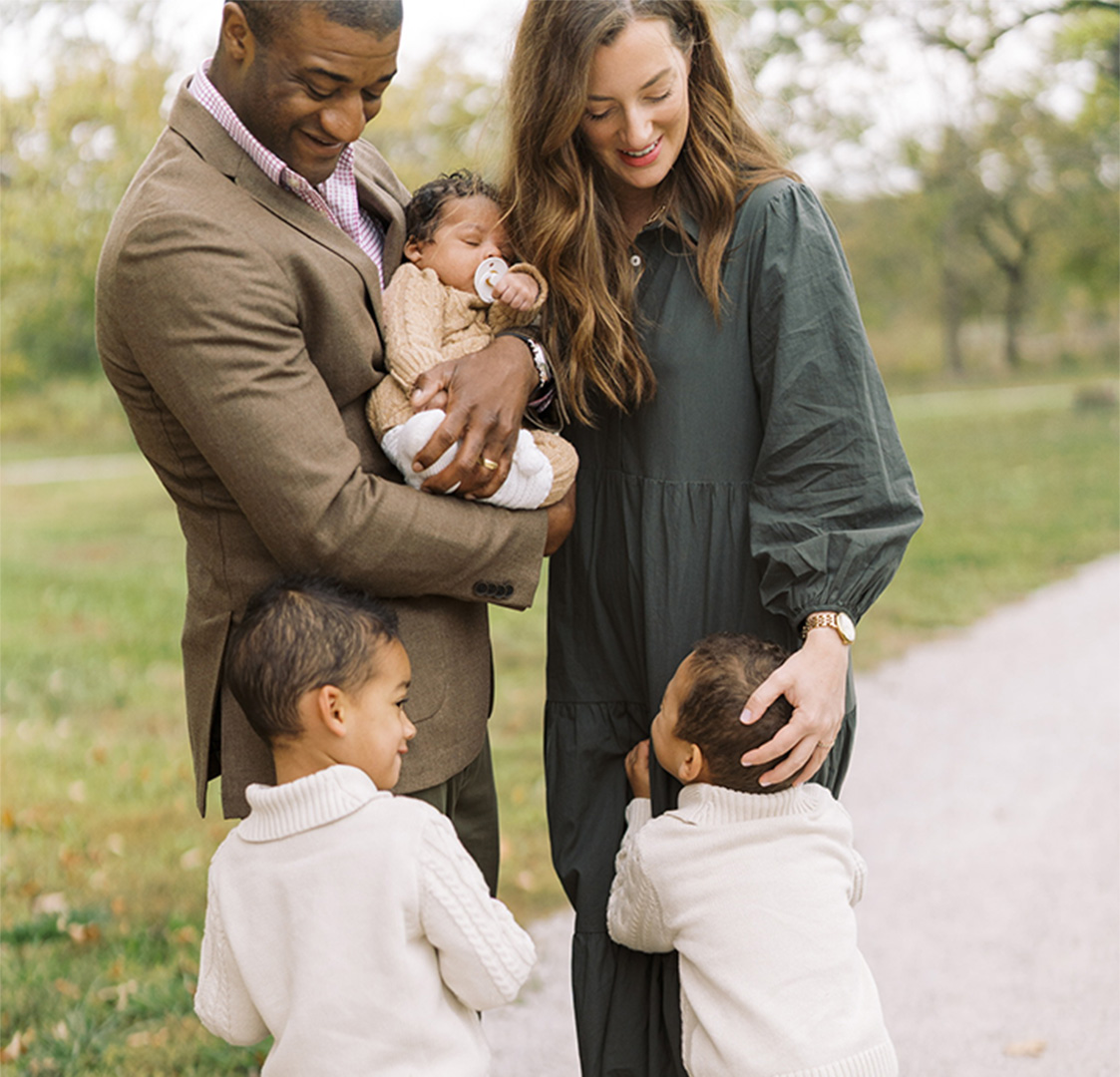 A candid shot of Vernon Norman with his wife and three children
